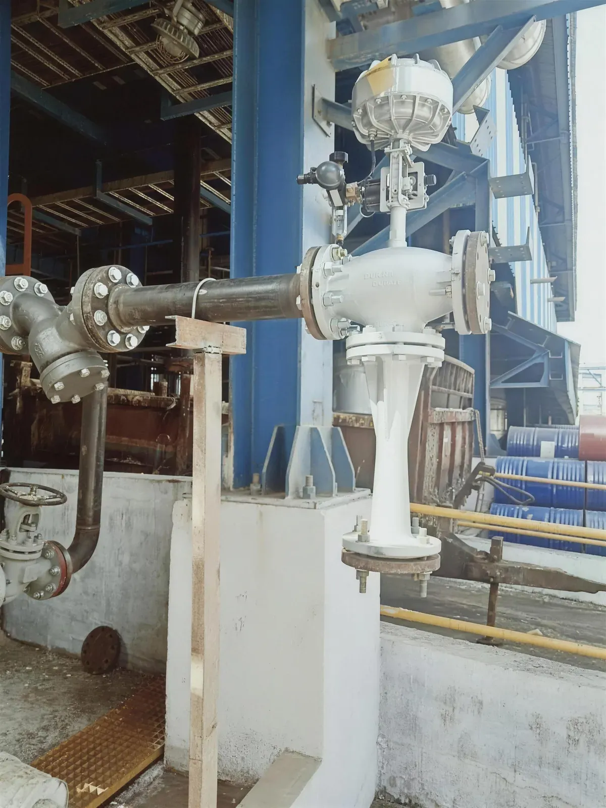 A variable-nozzle Jetomat thermocompressor installed on a steam line in a chemical plant