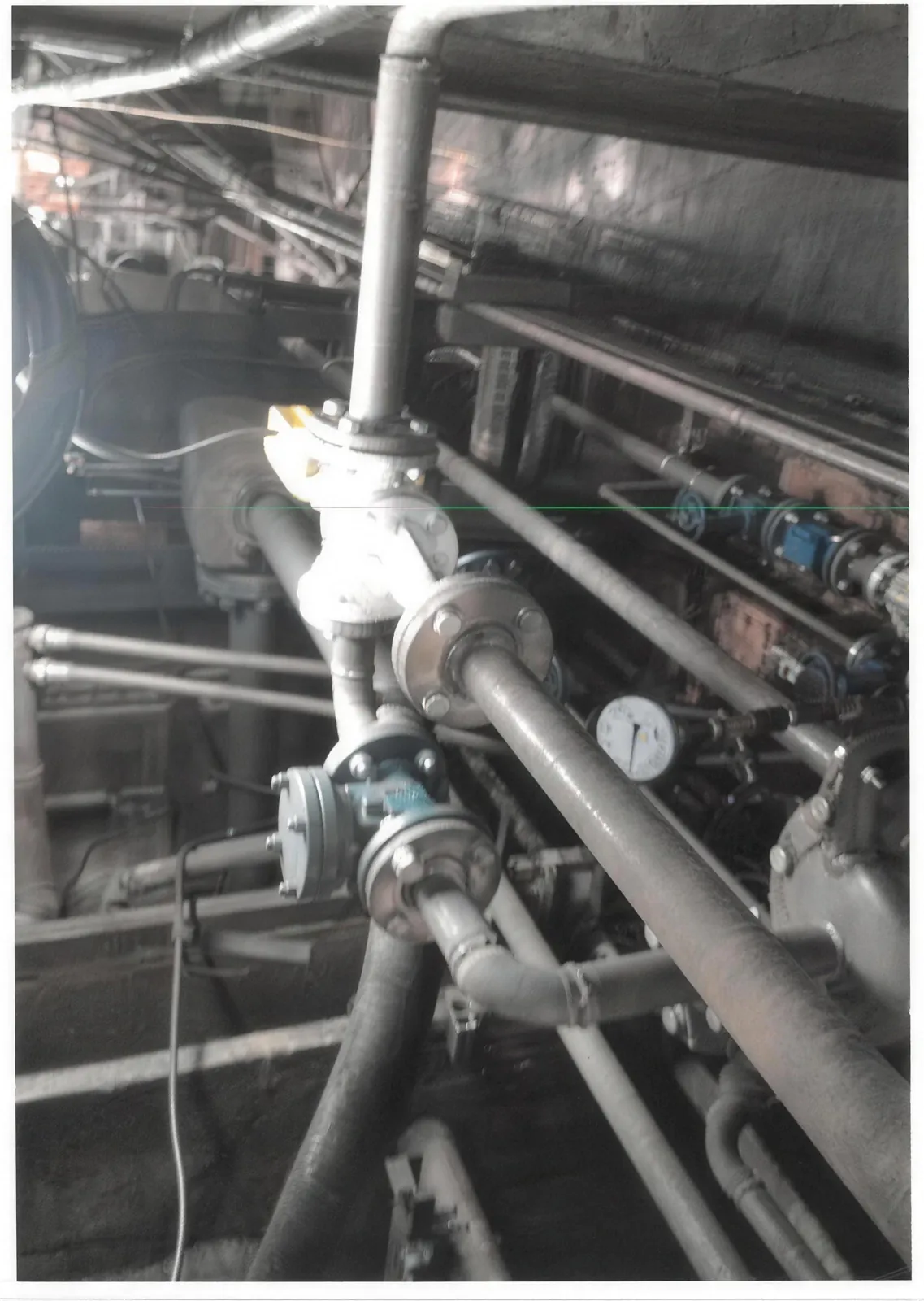 The Jetomat and the separator piping under the rubber press