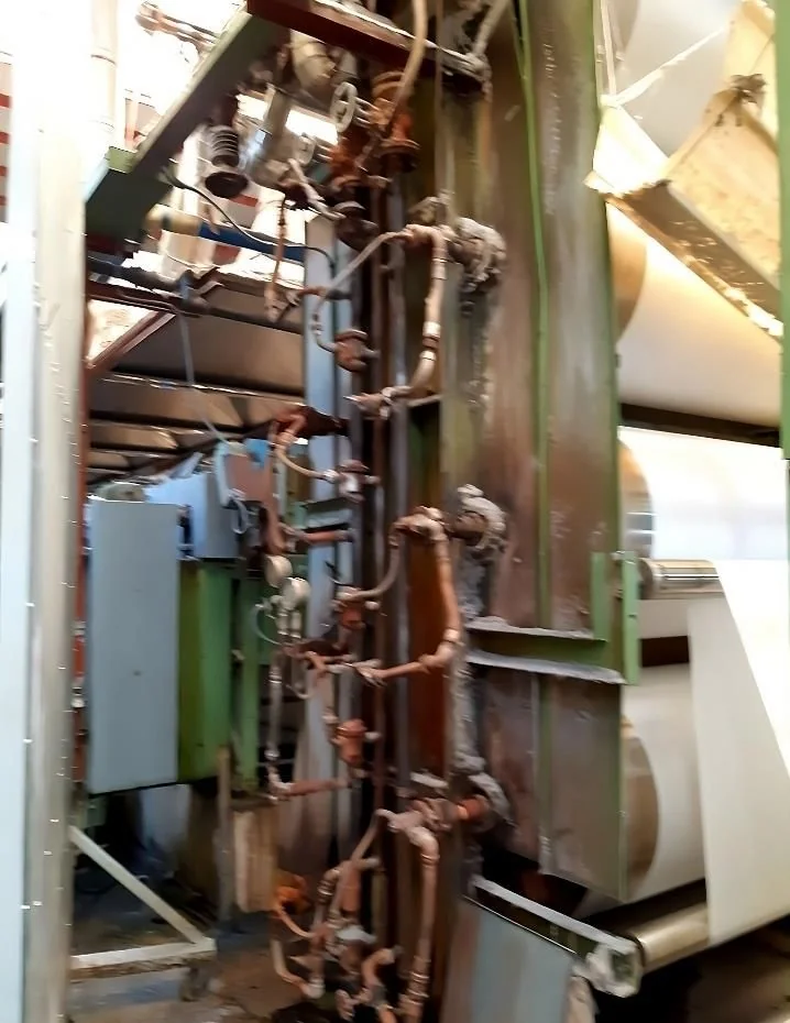 The tower of eight drying cylinders with its steam and condensate piping