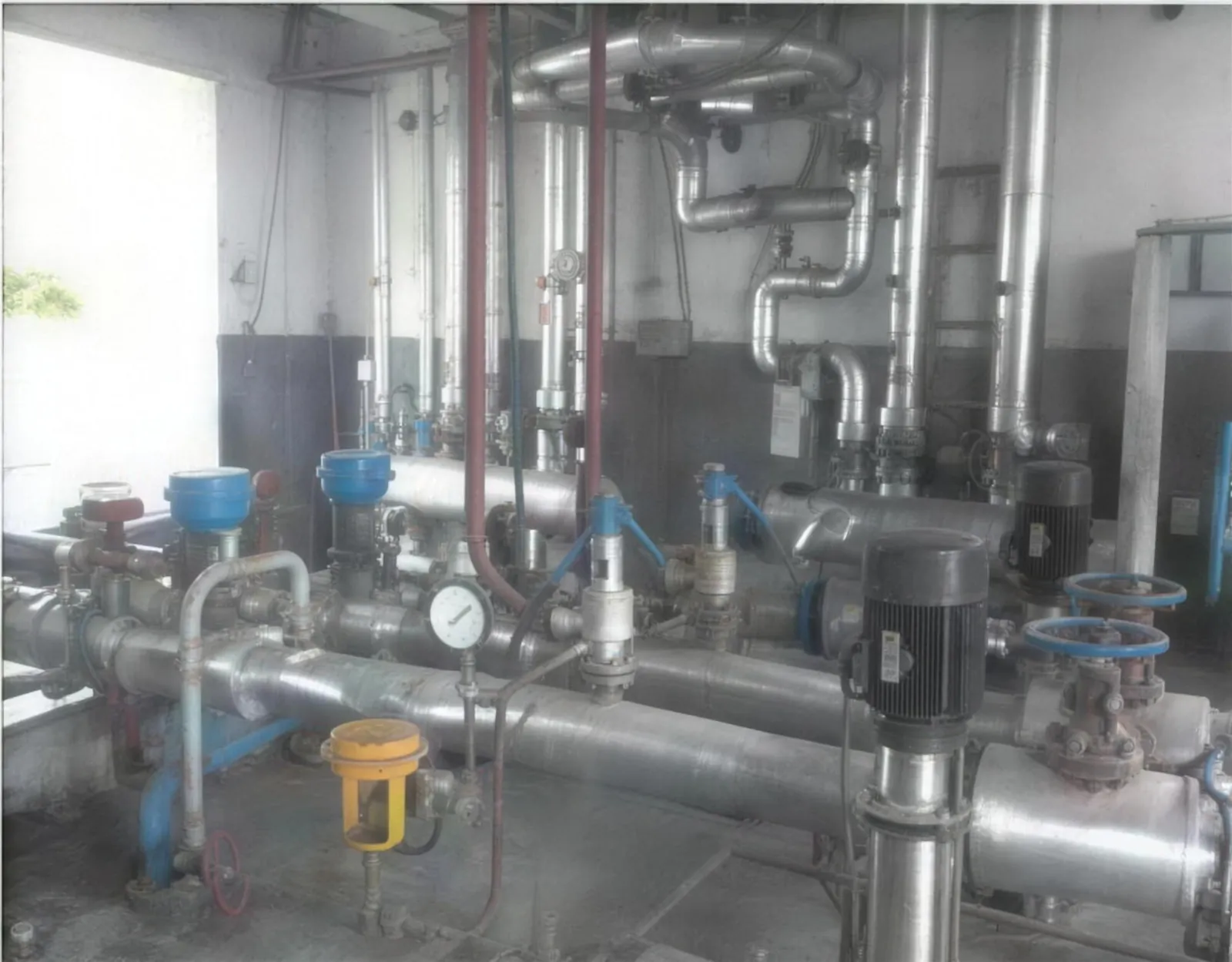 Before: a control valve and steam trap at each machine